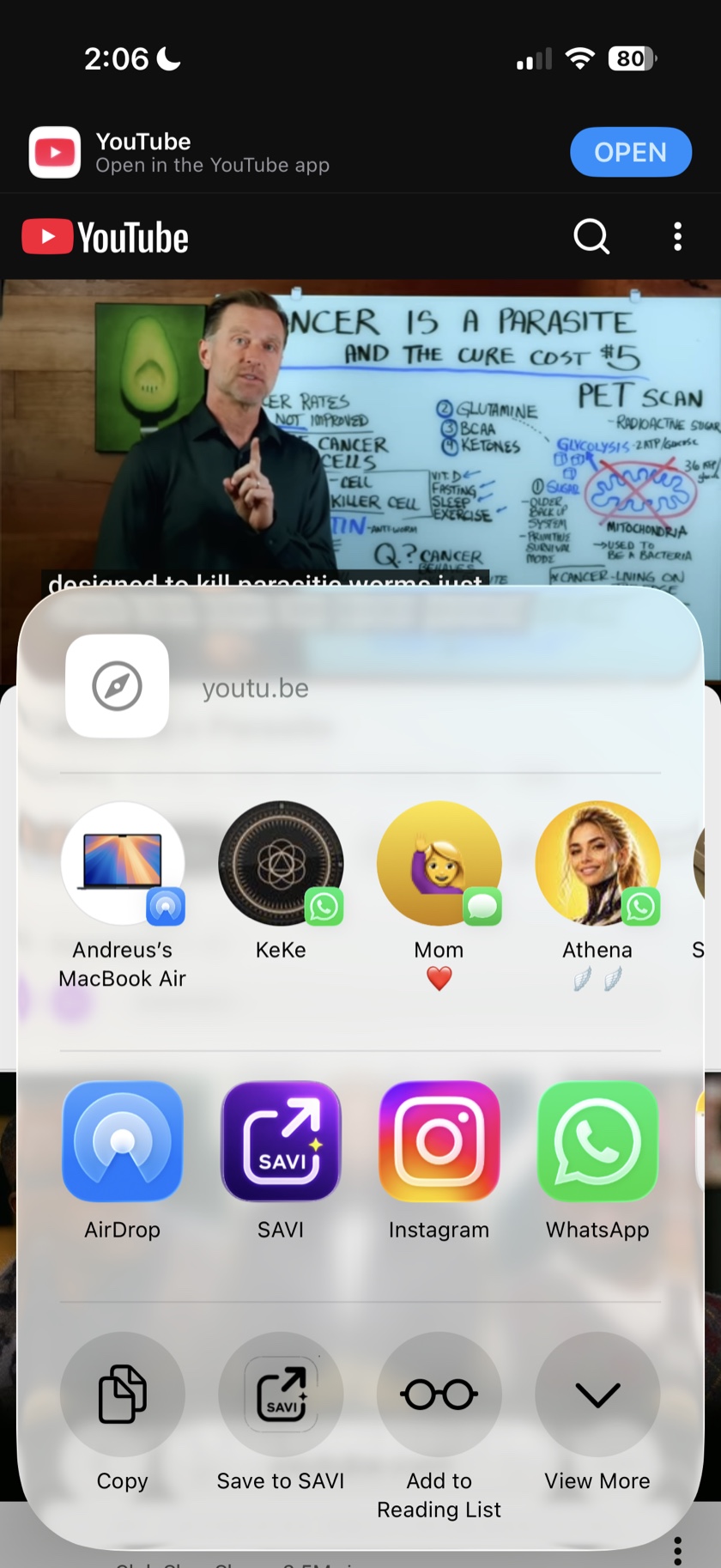 Real iOS Share Sheet over a YouTube video with the SAVI app icon and Save to SAVI action ready